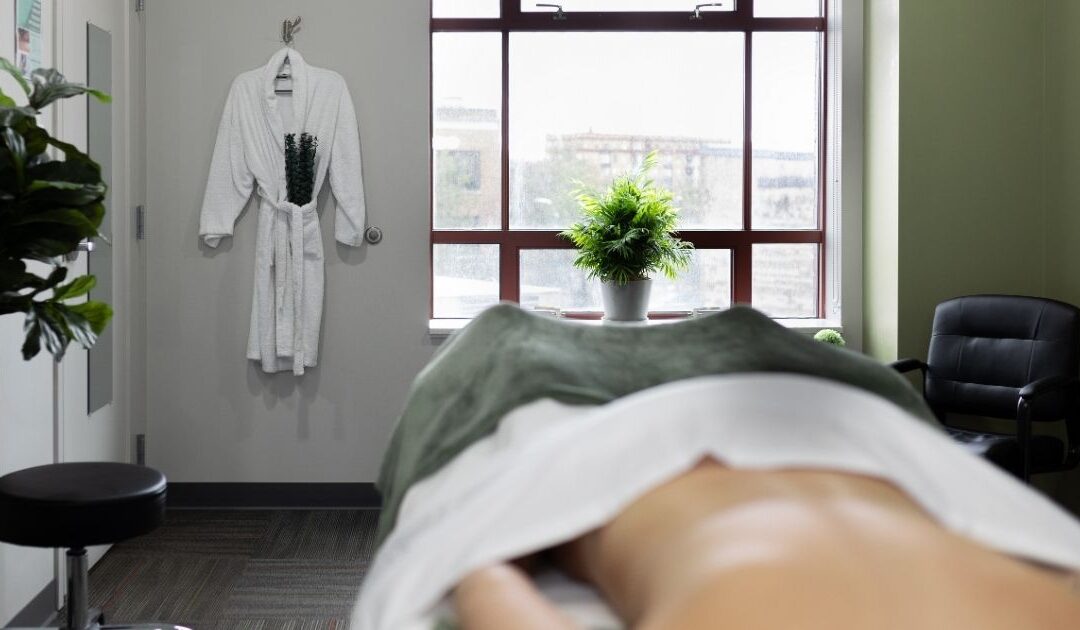 Therapeutic massage session at Hand in Health, a Syracuse wellness clinic supporting mental health.